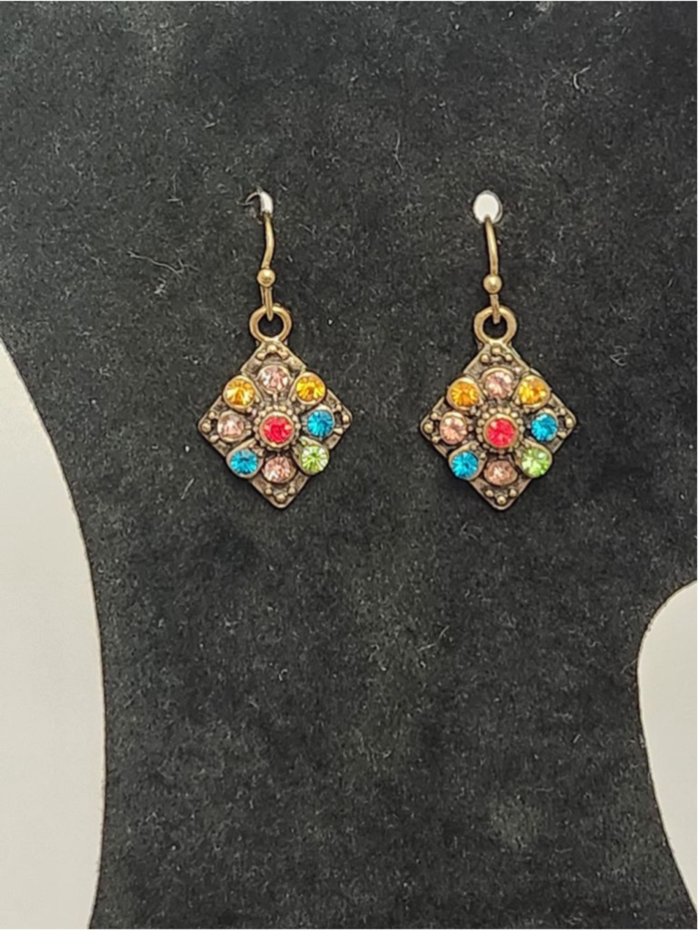 Bohemian designed with a rhombus shaped pendent adorned with multicolored stones